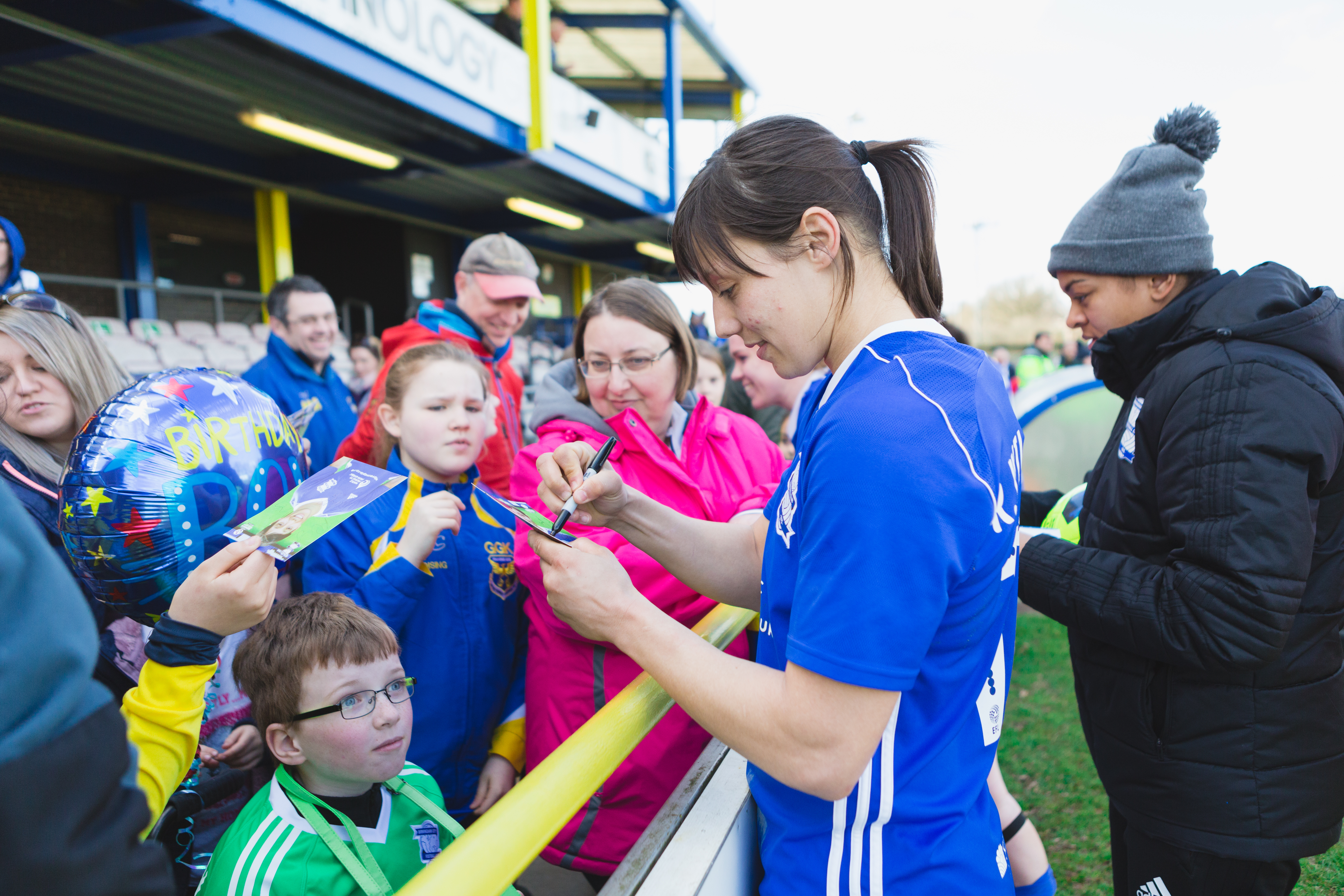 Birmingham City Ladies FC player signing autographs