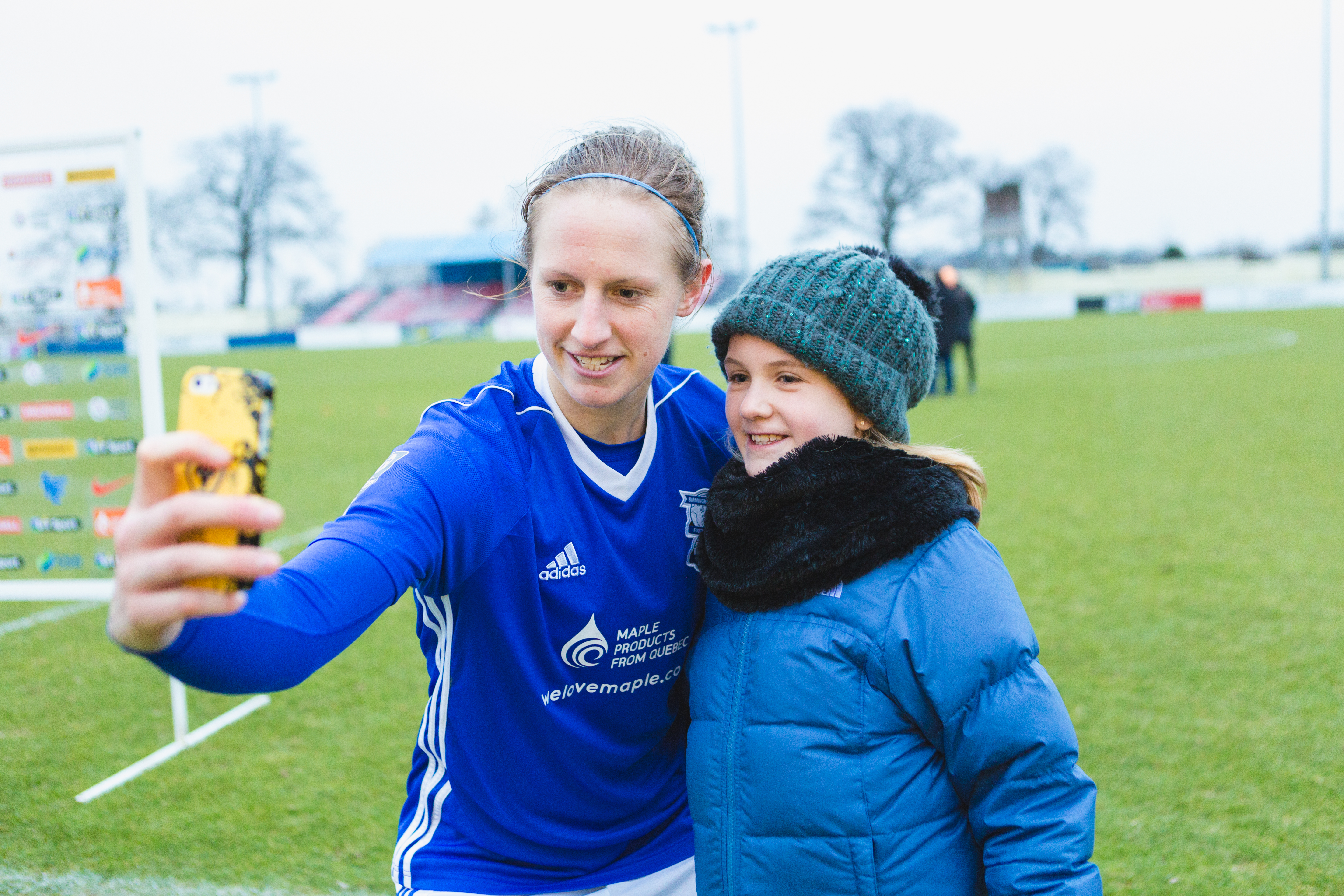 Birmingham City Ladies FC player taking a selfie with a fan
