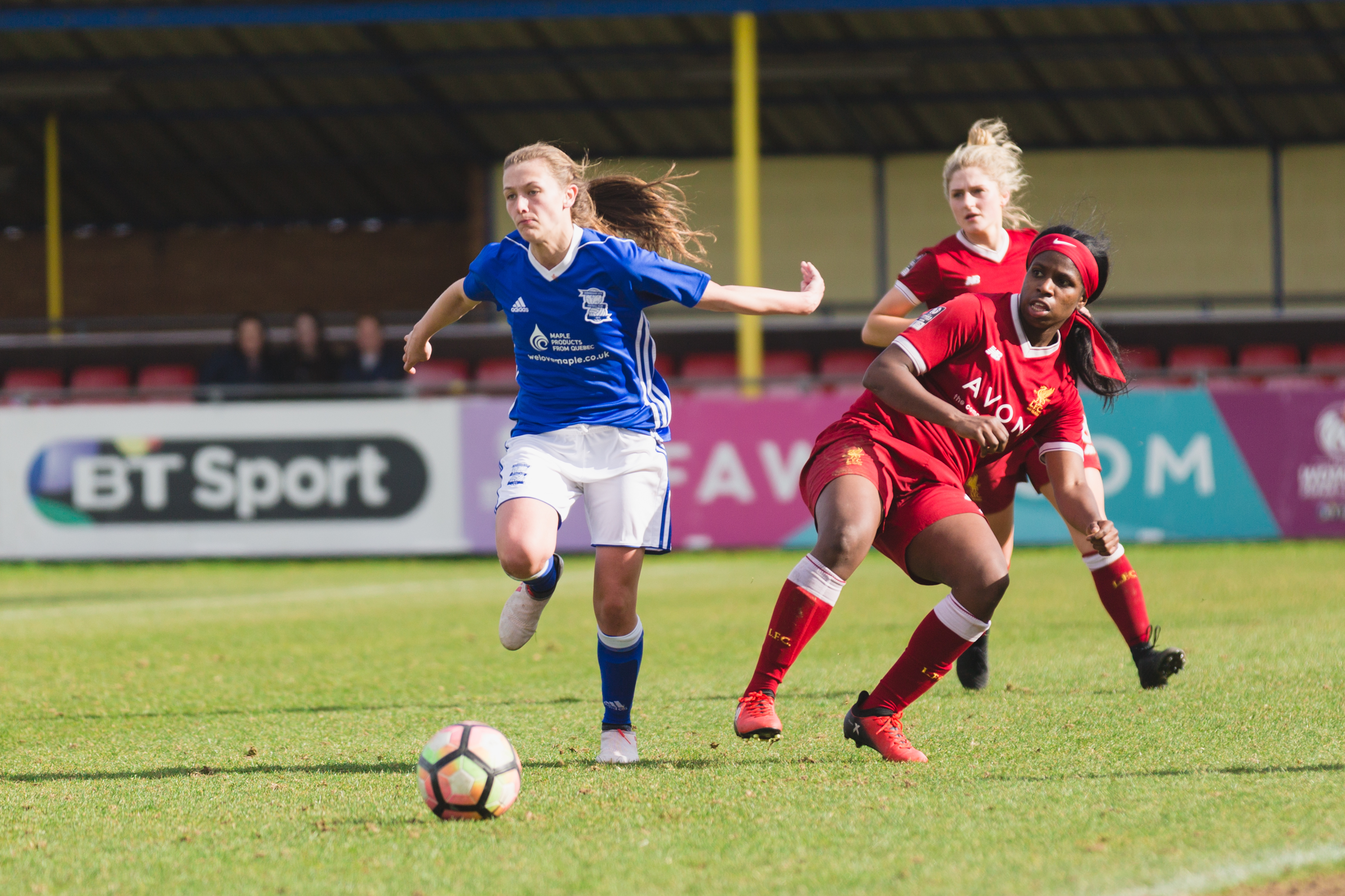 Birmingham City Ladies FC player chasing down the ball