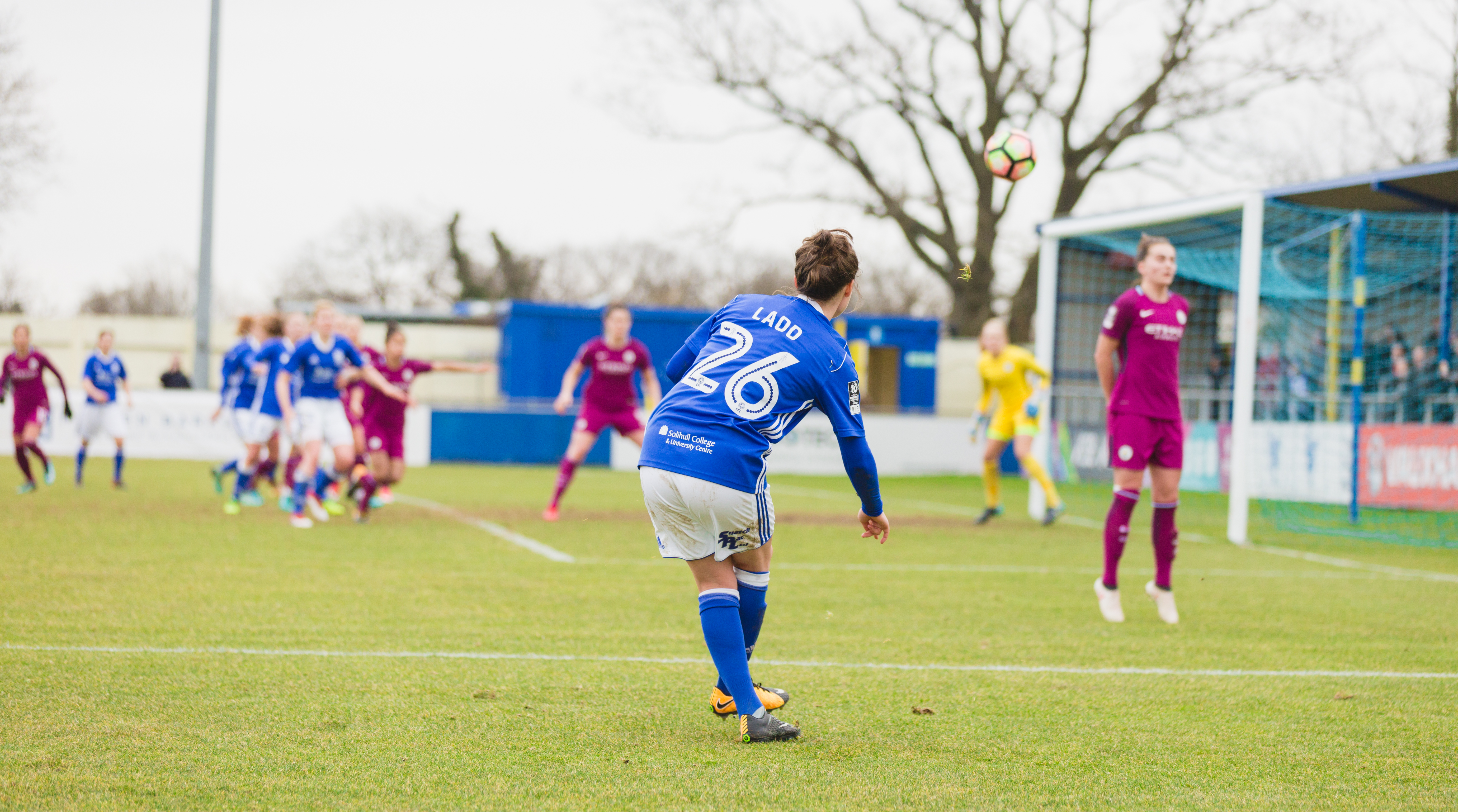 Birmingham City Ladies FC kicking the ball towards goal