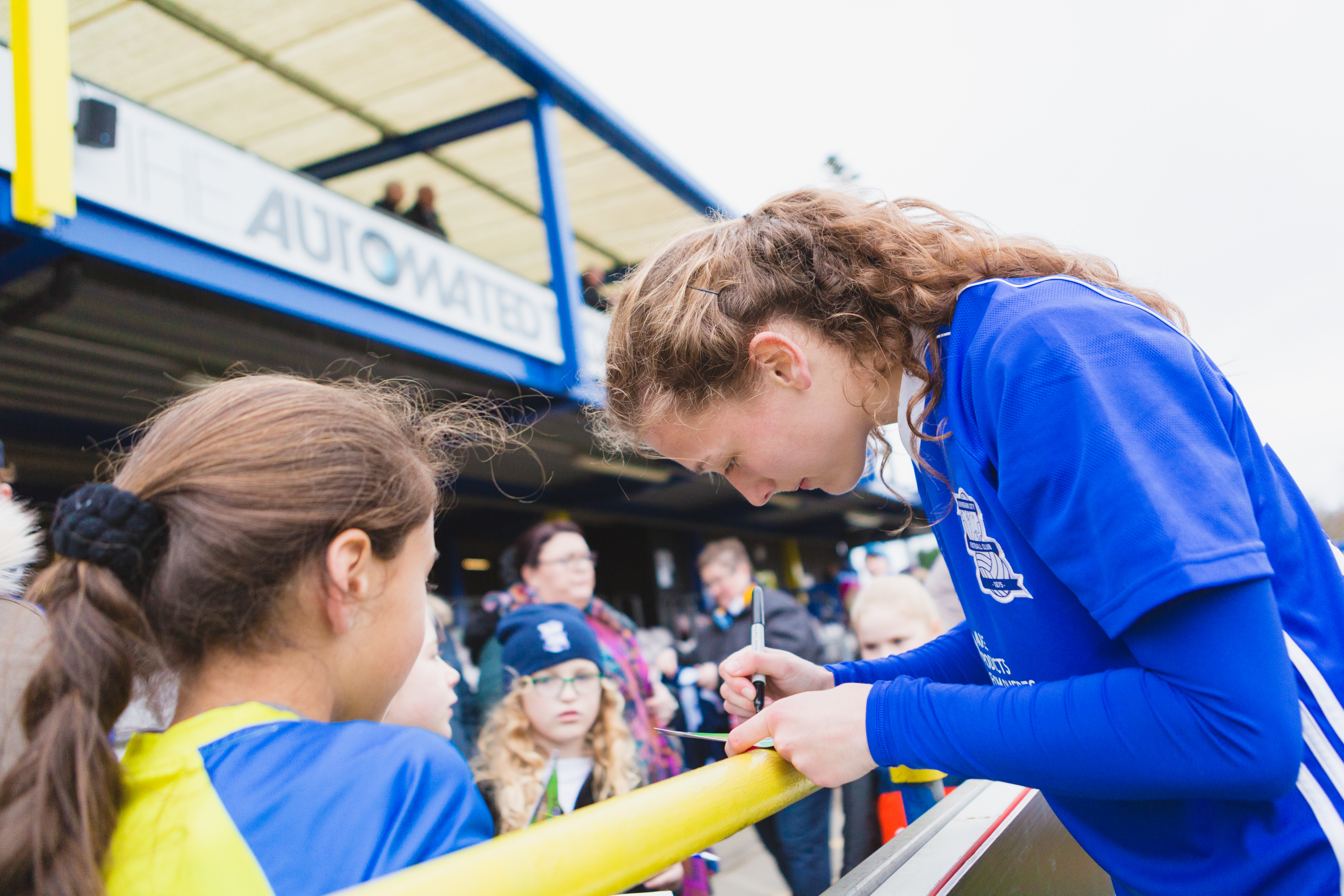 Birmingham City Ladies FC player signing autographs