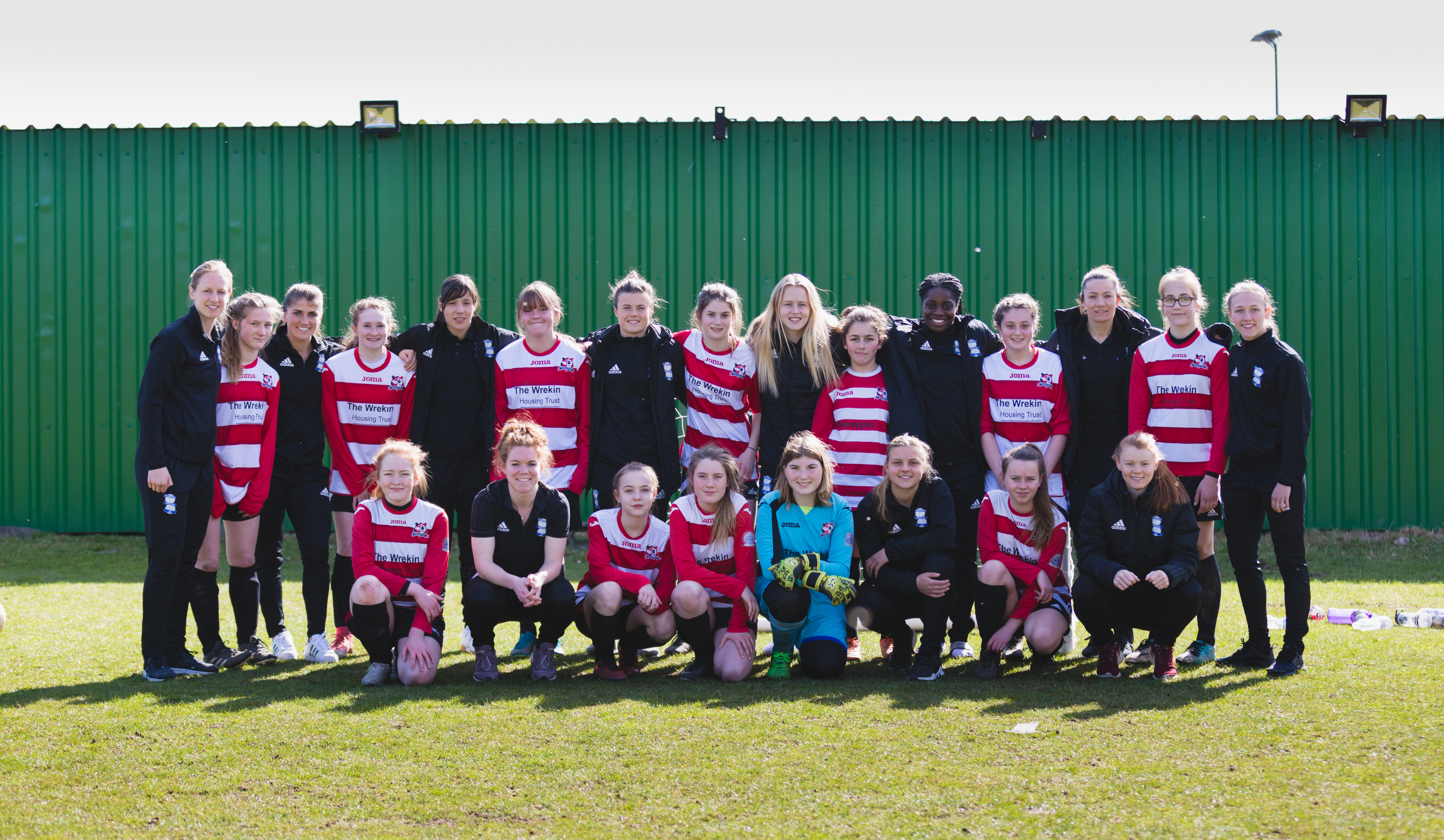 Birmingham City Ladies FC players with aspiring football players at football camp