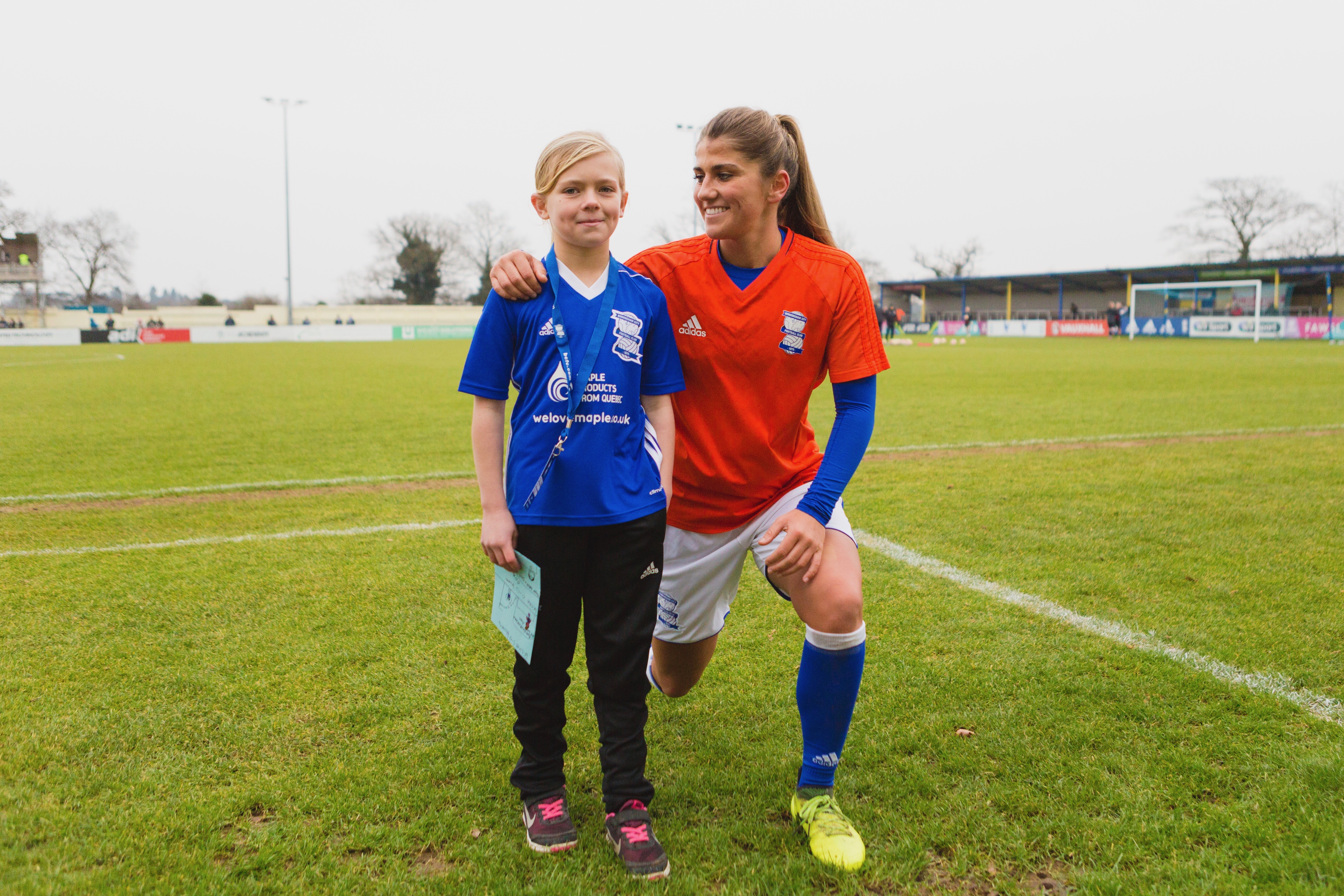 Competition winner, Kaitlyn Hicks-Kenward, with Blues defender, Paige Williams