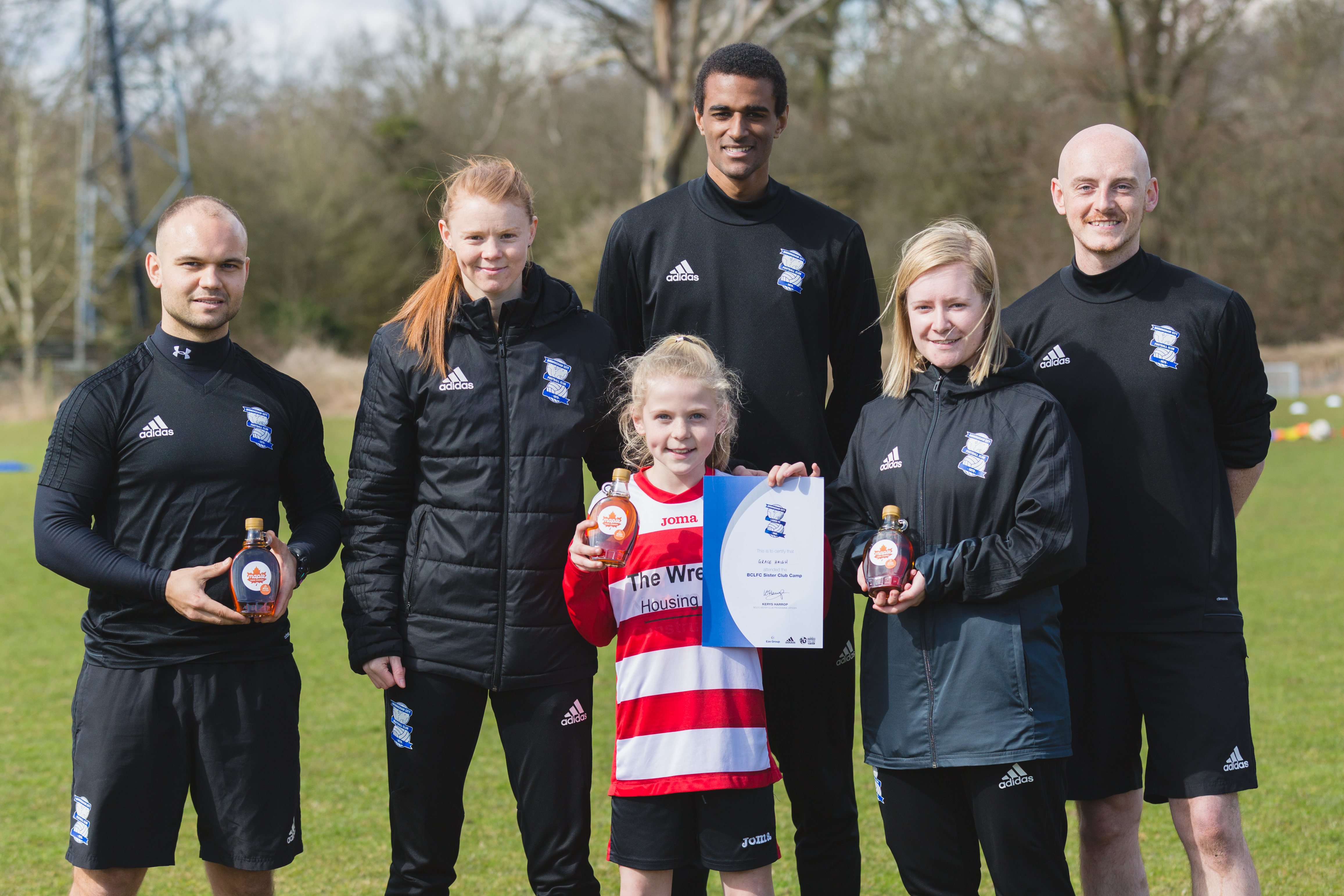 Maple from Canada winners: Lexie, Grace and Lauren with coaches