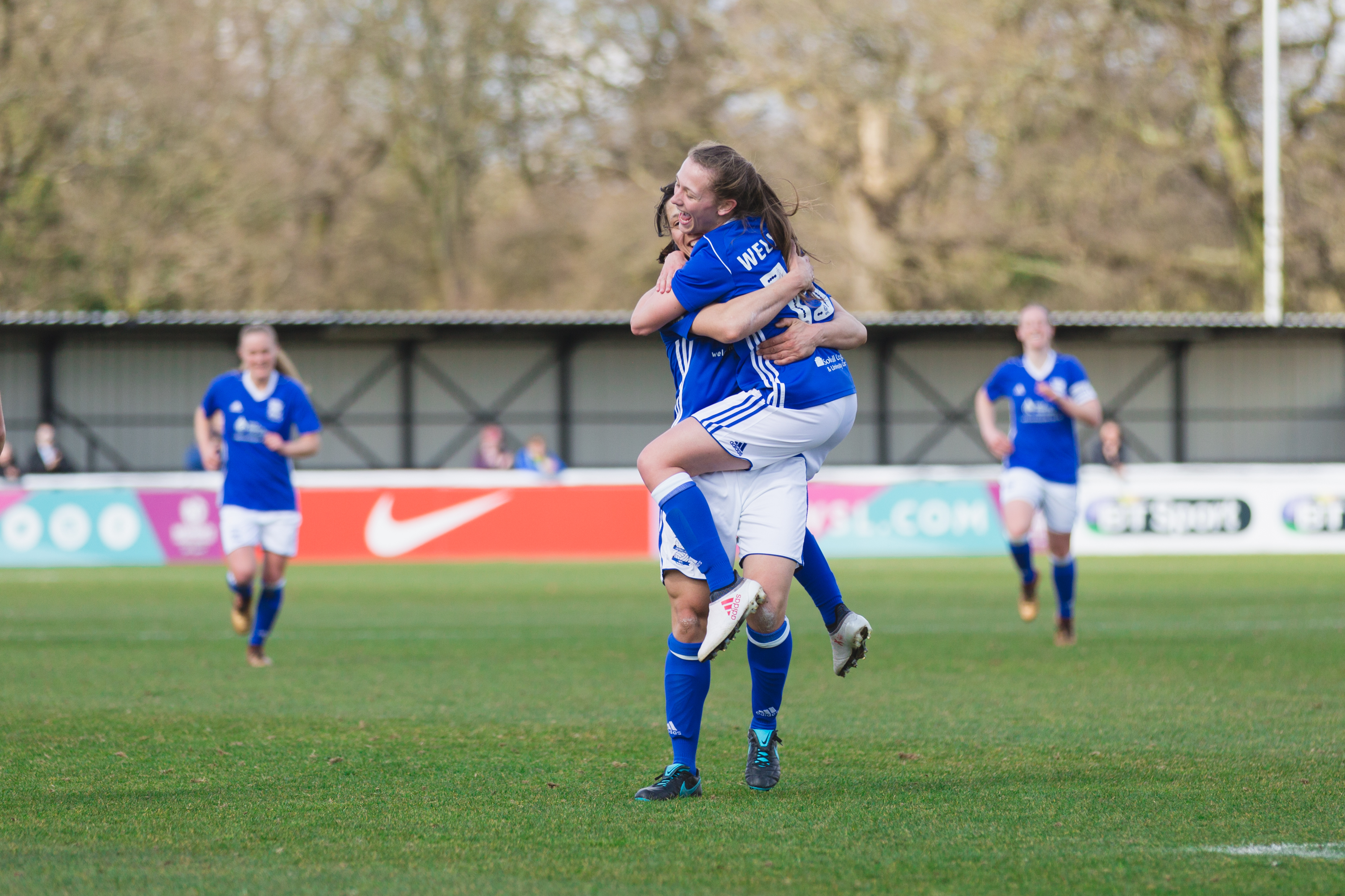 Birmingham City Ladies FC players celebrating 