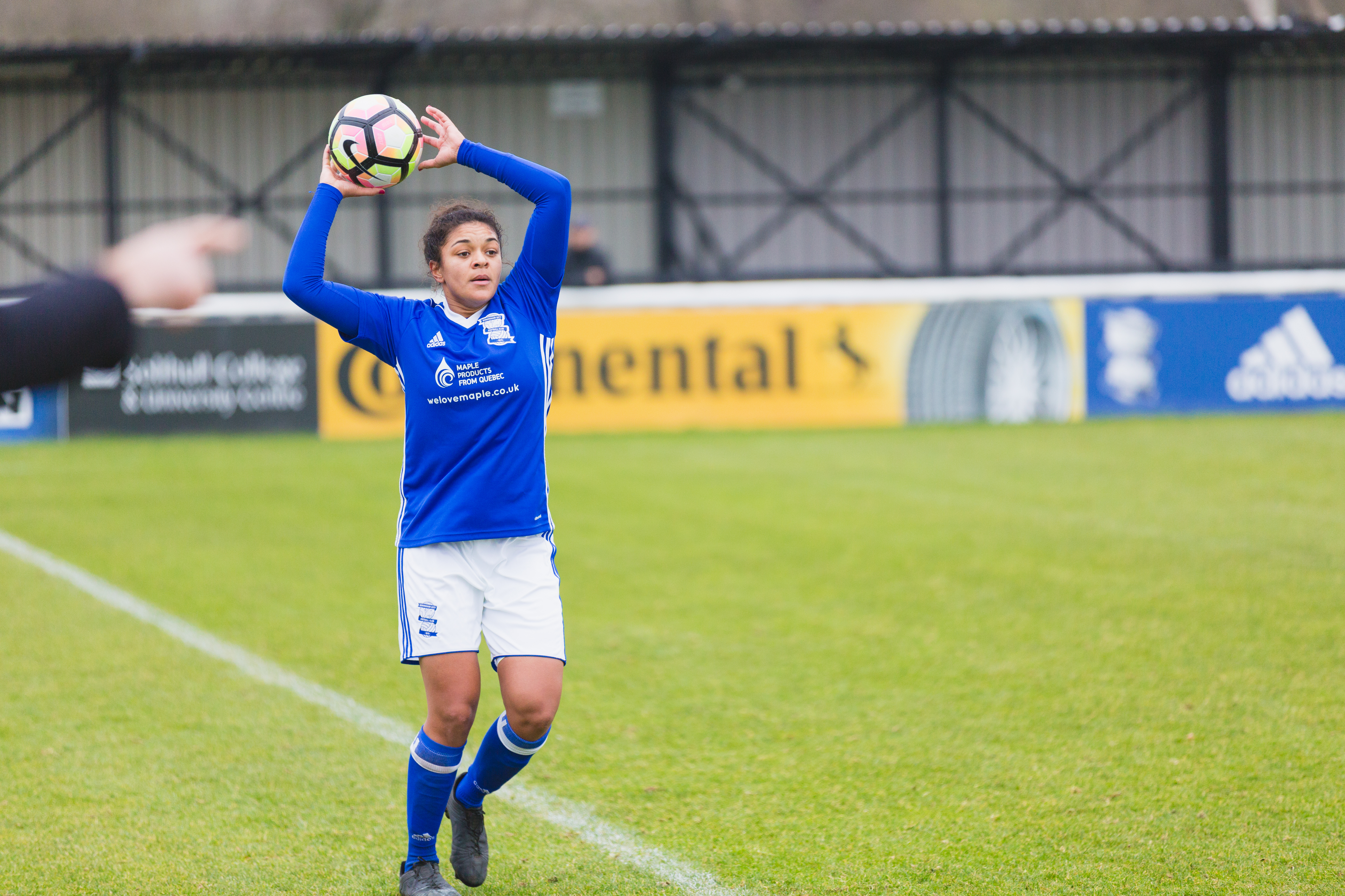 Birmingham City Ladies FC player throwing in the ball