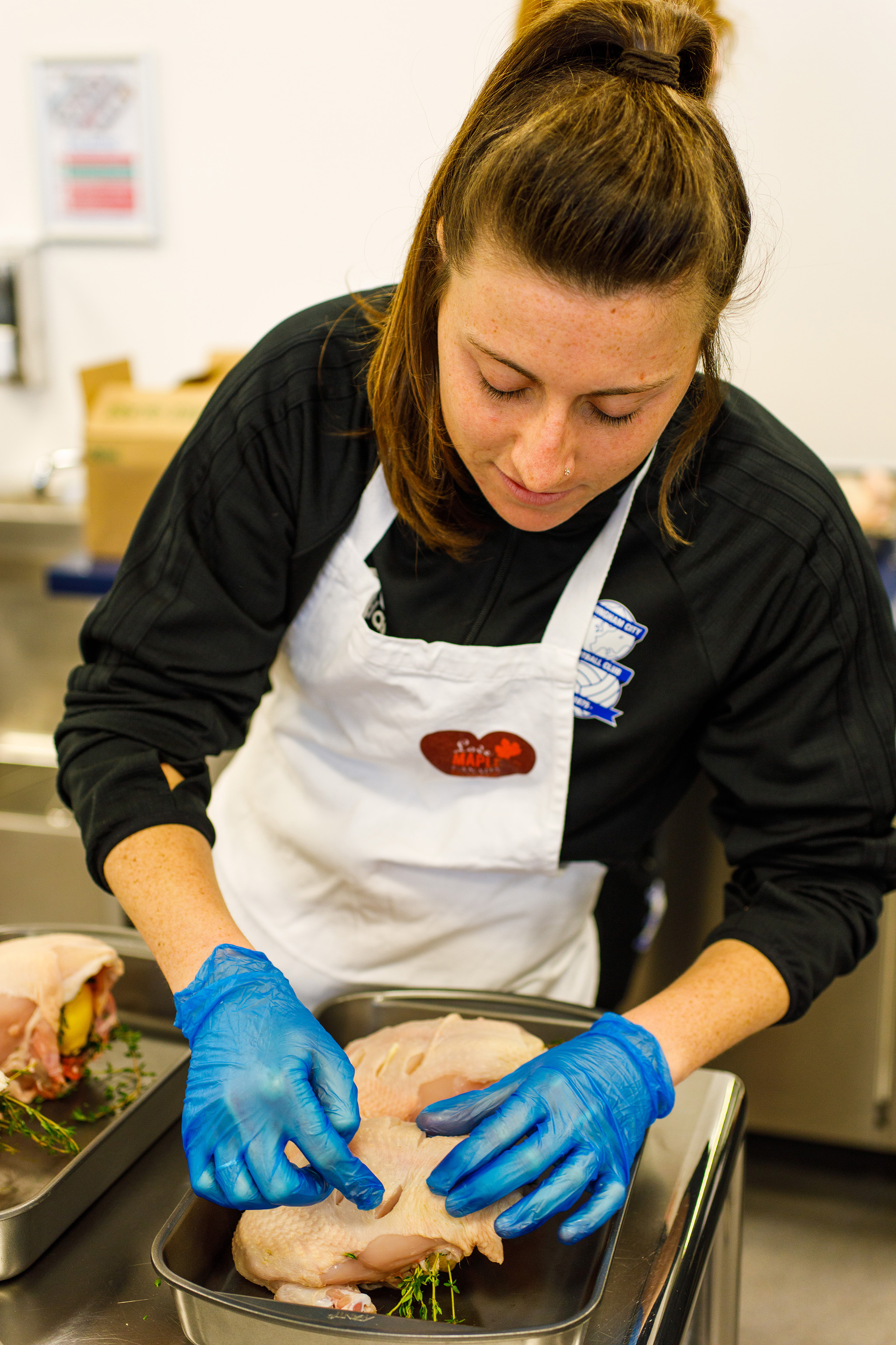 Birmingham City Ladies player prepping the free range roast chicken