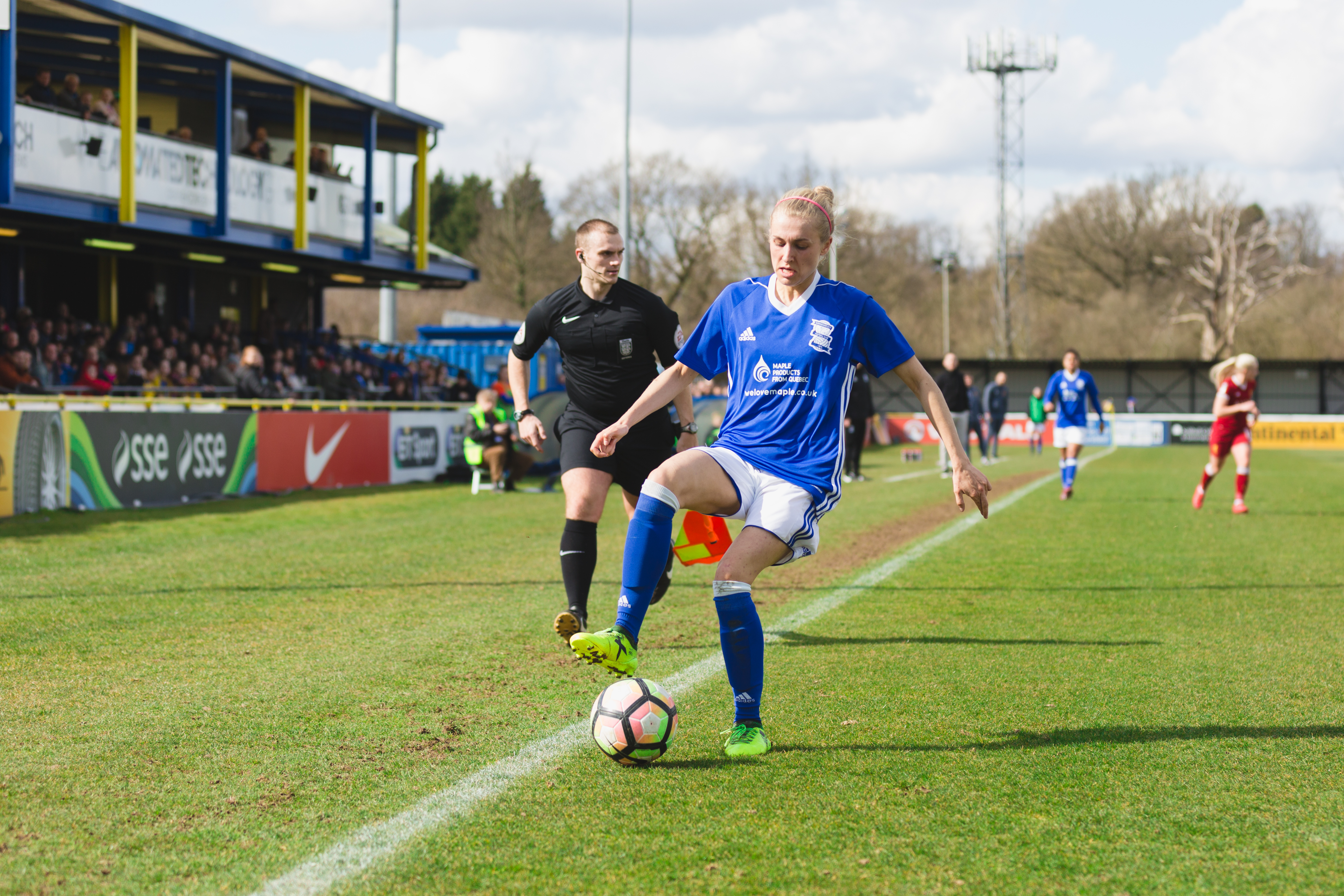 Birmingham City Ladies FC player turning the ball