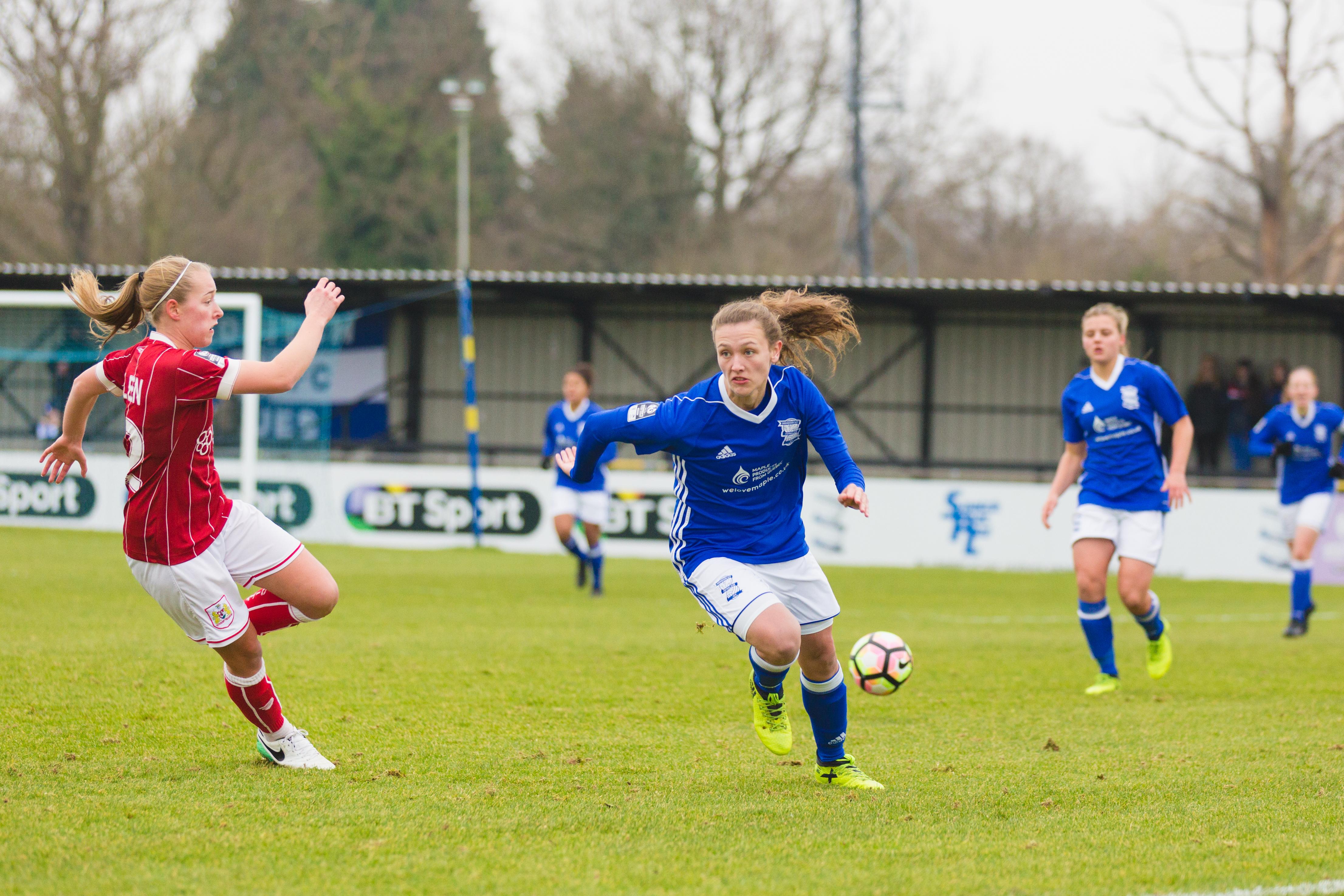 Birmingham City Ladies FC player running with the ball