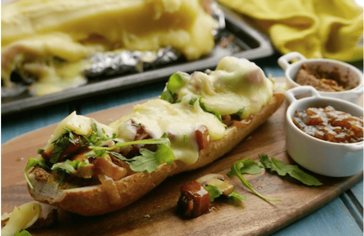 Sunday Brunch raclette baguette, with maple bacon, chestnut mushrooms and toasted hazelnuts