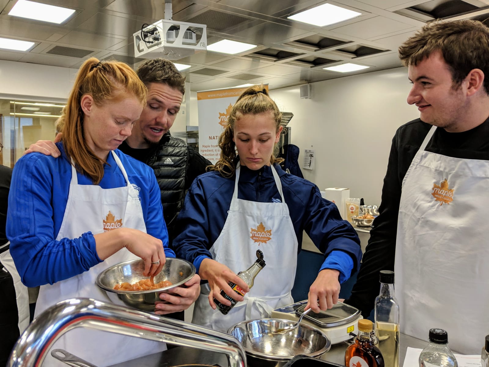 Birmingham City Ladies FC players mixing ingredients