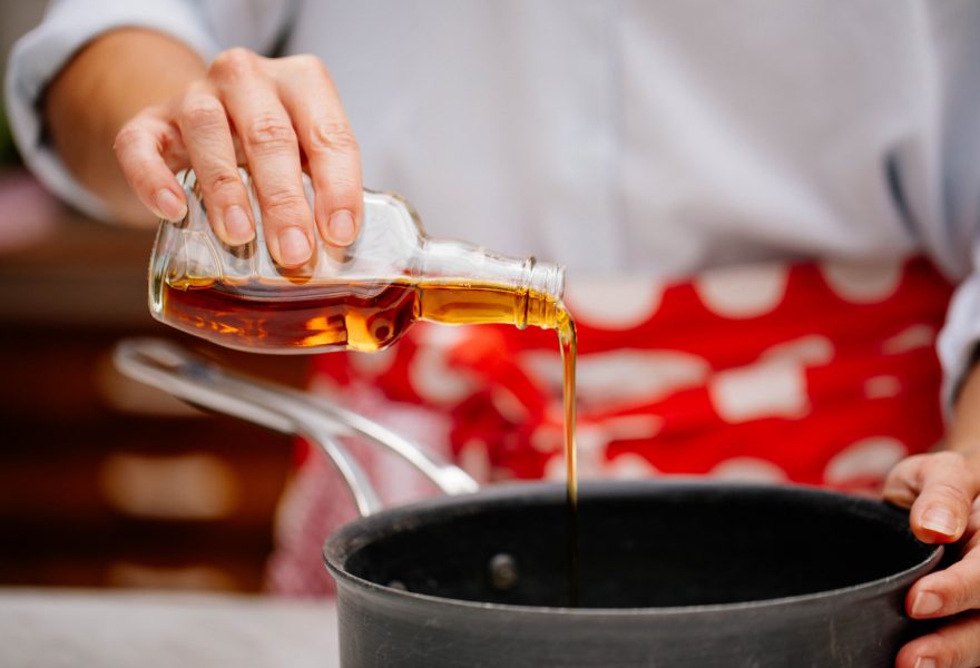 Pouring maple syrup into a pan
