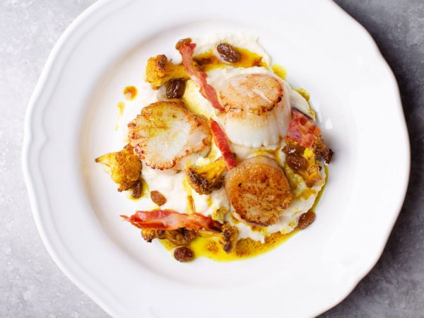 Seared scallops with maple roasted cauliflower and pancetta