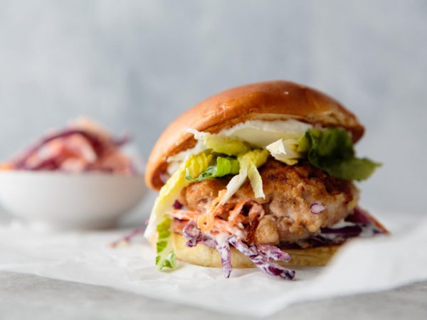 Spicy jerk chicken burger with maple slaw