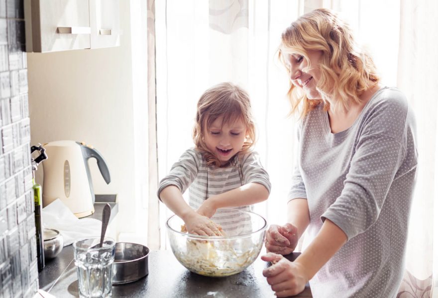 Mother and daughter cooking