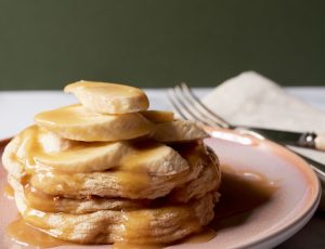 Banana Soufflé Pancakes with Fresh Banana and Maple Caramel