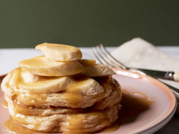 Banana souffle pancake with fresh banana and maple caramel